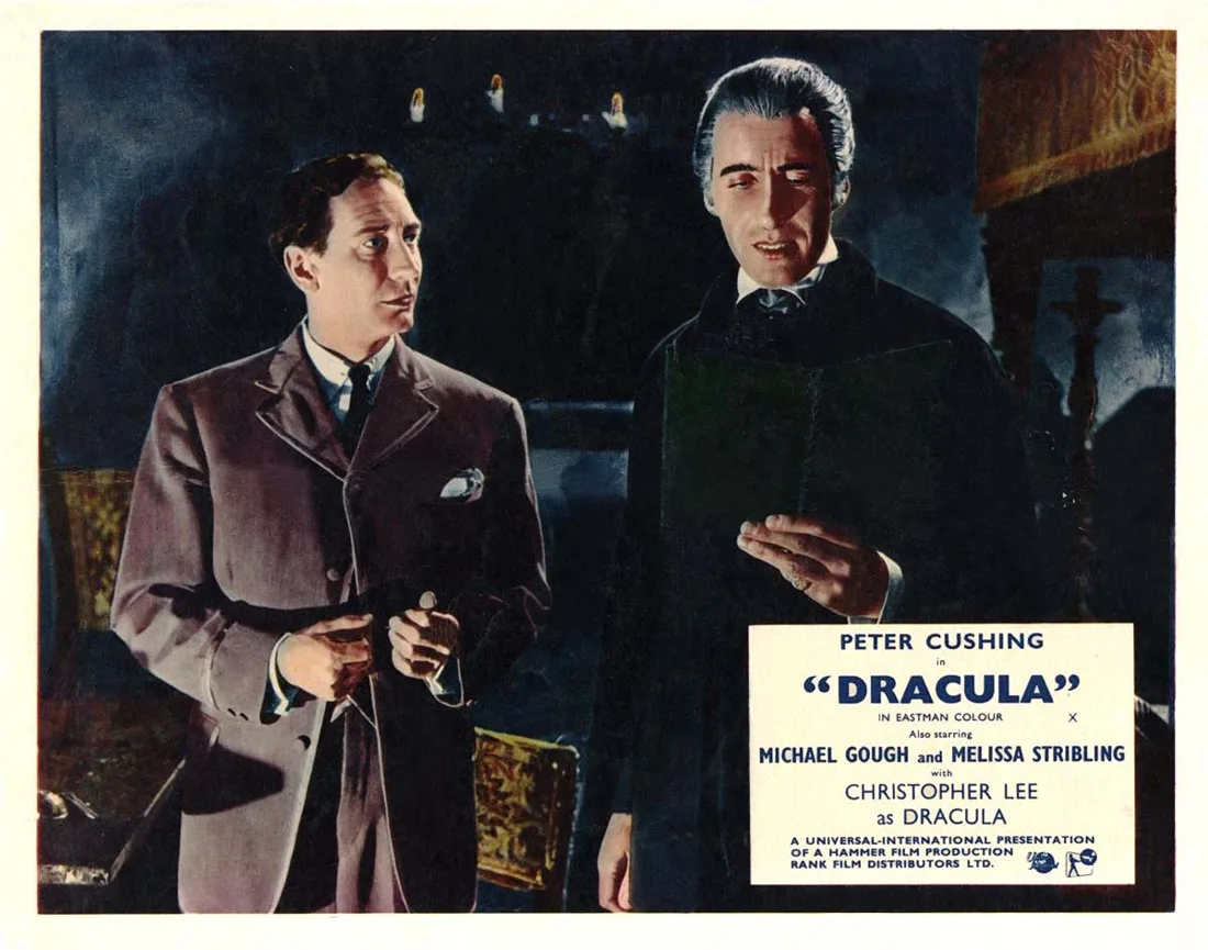 Christopher Lee as Dracula, with John Van Eyssen as Jonathan Harker, in Dracula (1958). Hammer lobby card.